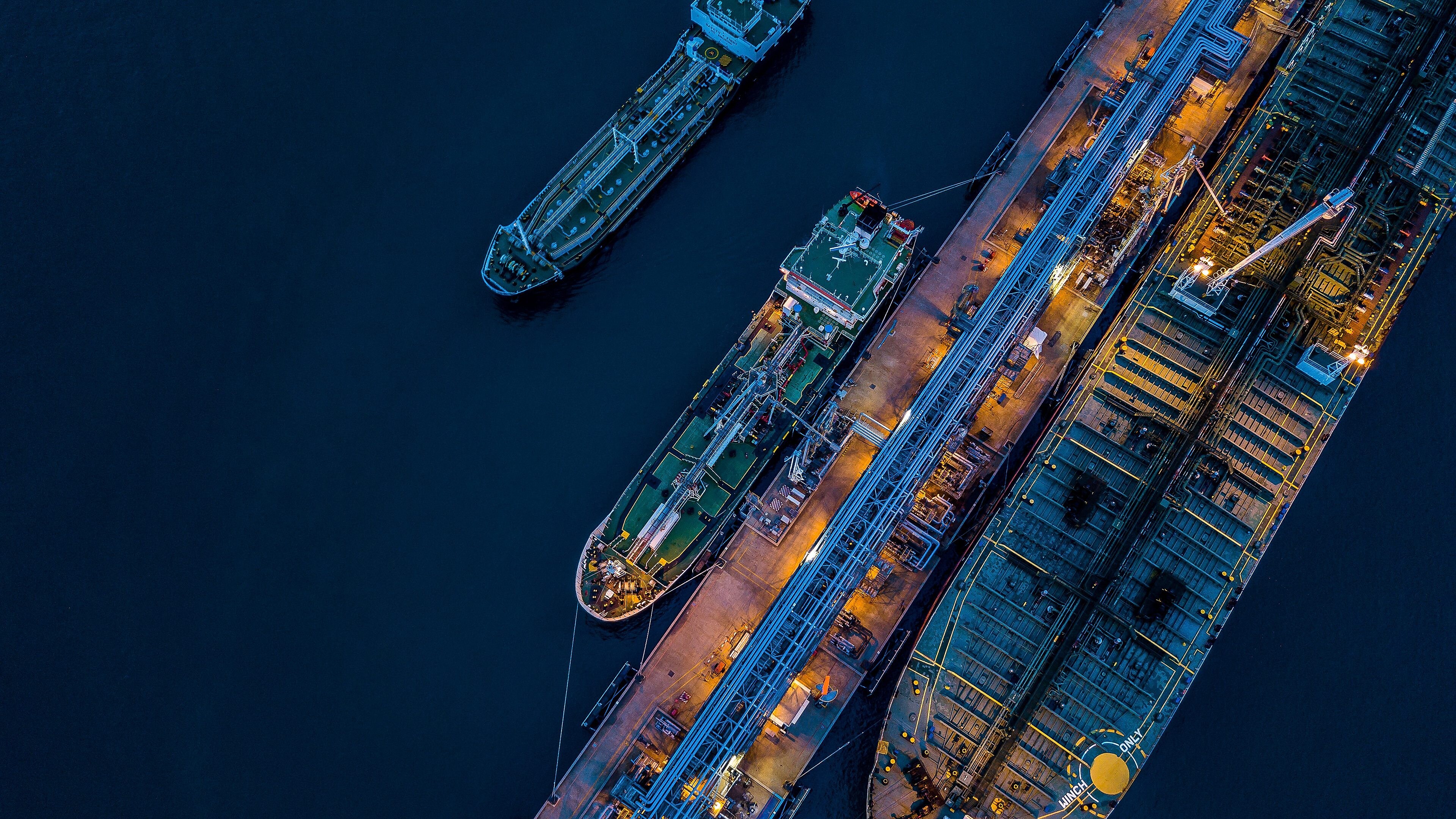 A cargo ship docked from a birds eye view