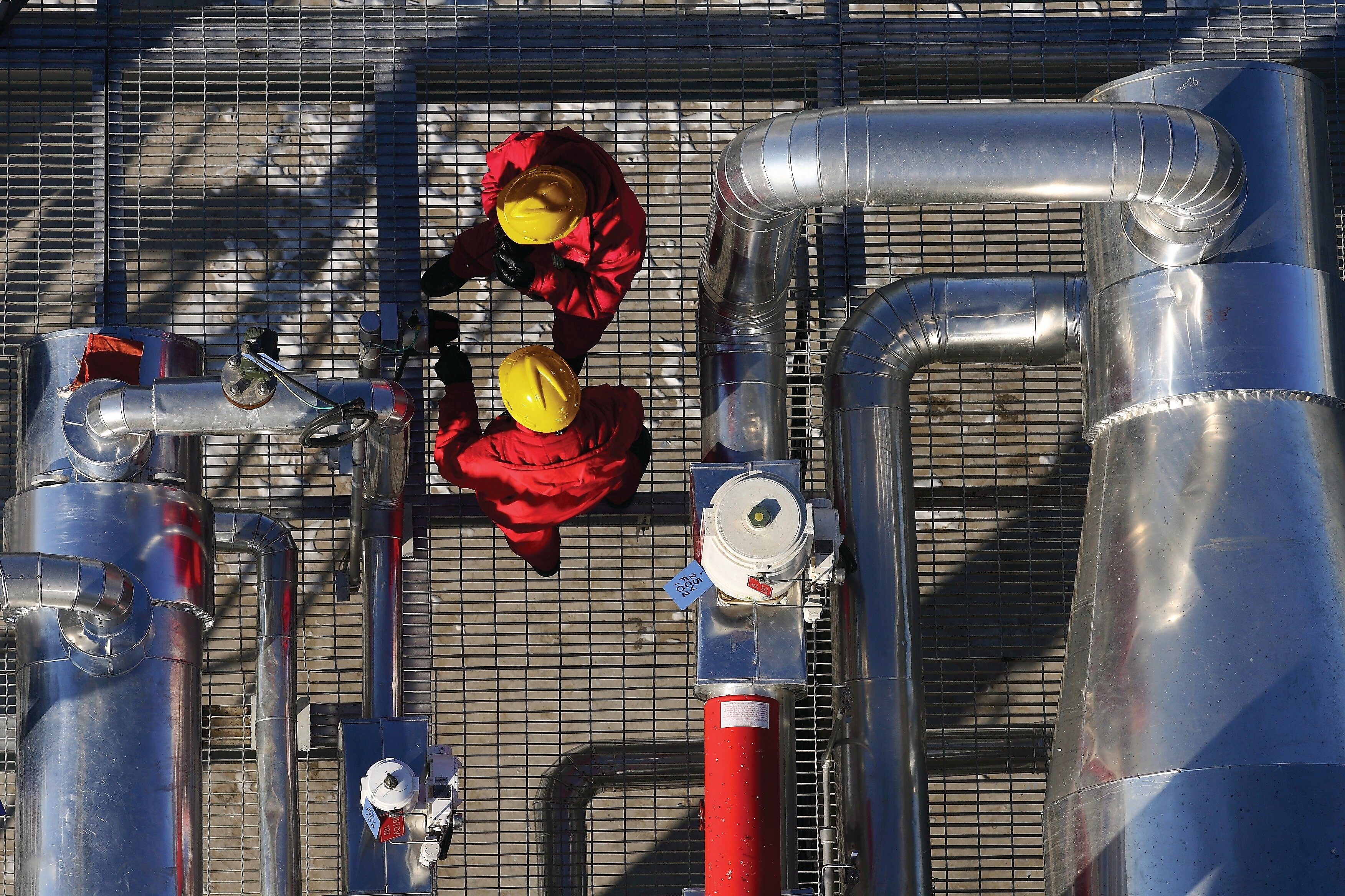 two shell employees working at processing facility