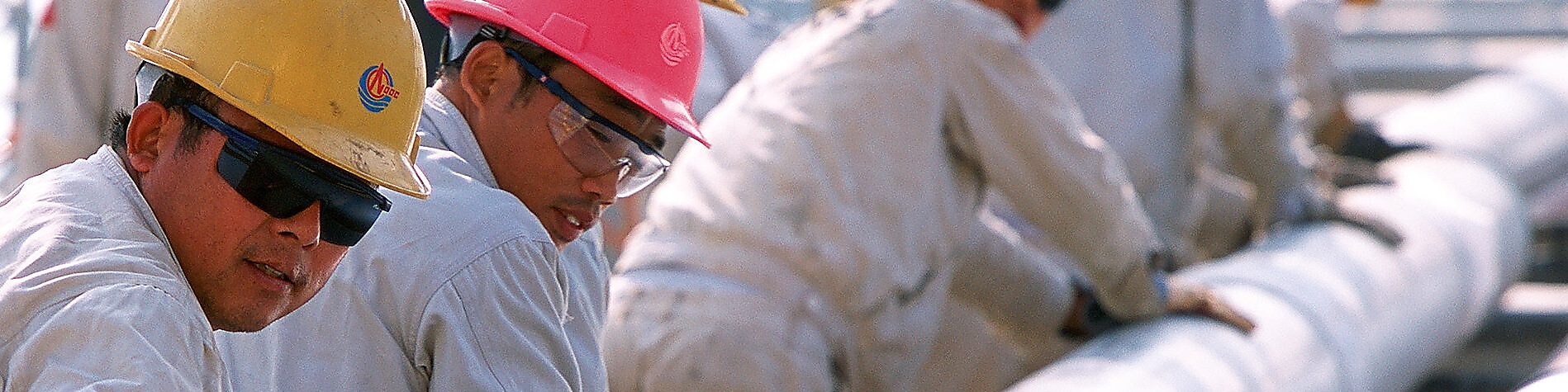 Shell workers moving catalyst equipment