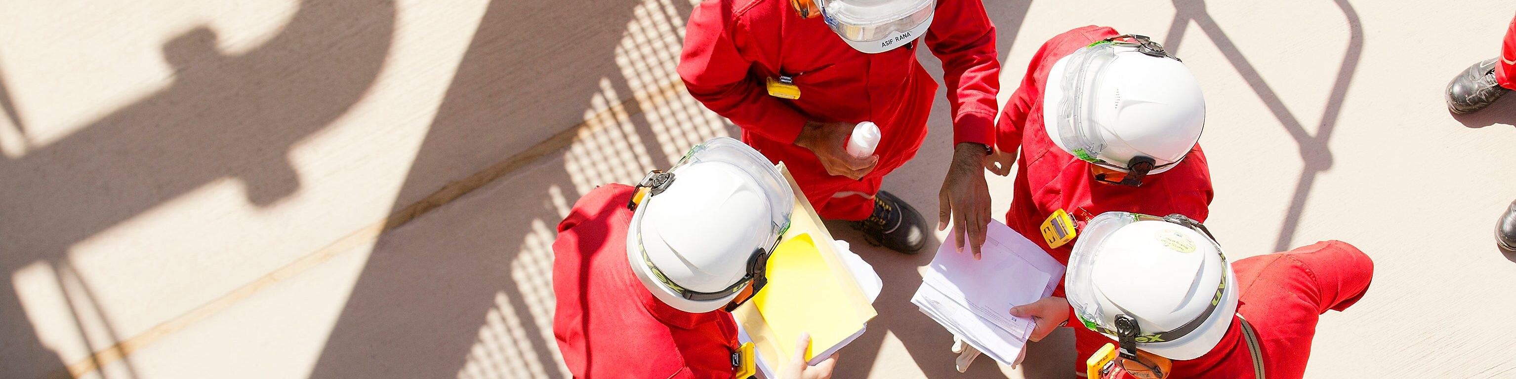 Four workers having a word