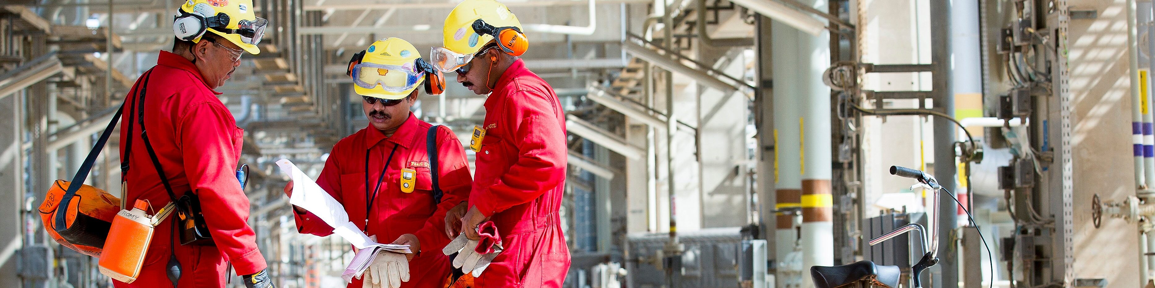 Three workers having a discussion