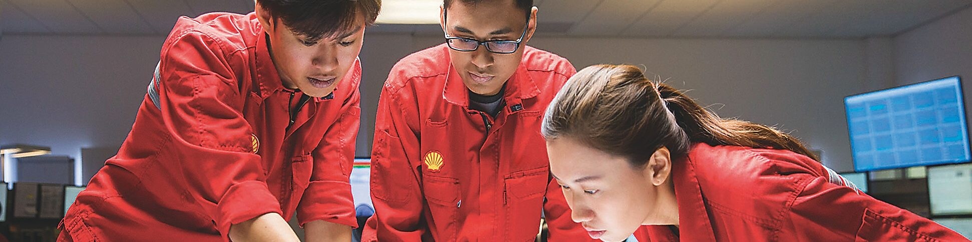 Three workers planing 