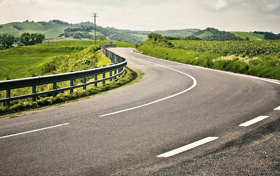 Well maintained road with surrounding of trees