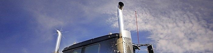 Roof and top of a truck showing exhaust pipes