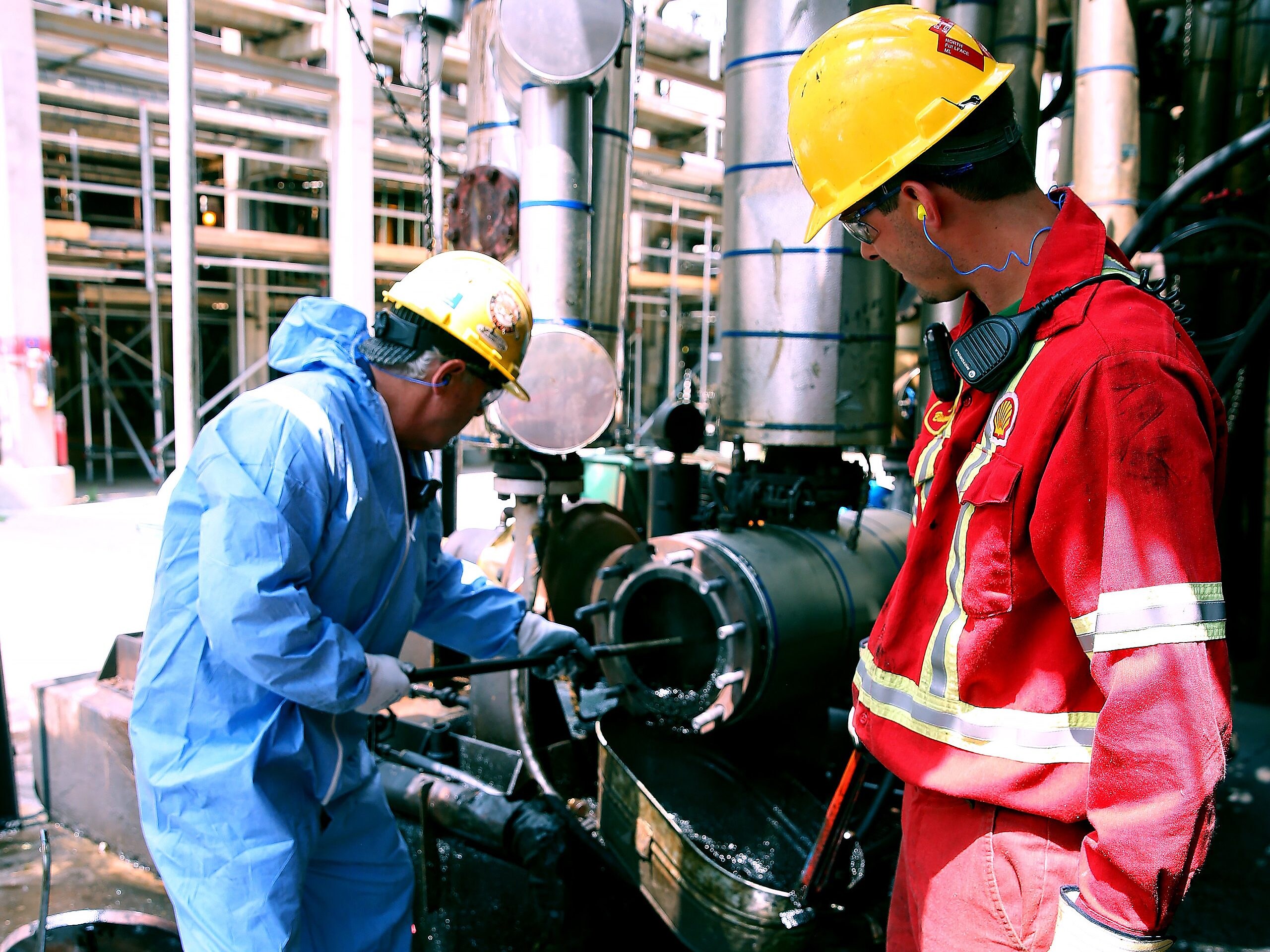 Shell Sarnia workers clean a suction screen used in residue upgrading