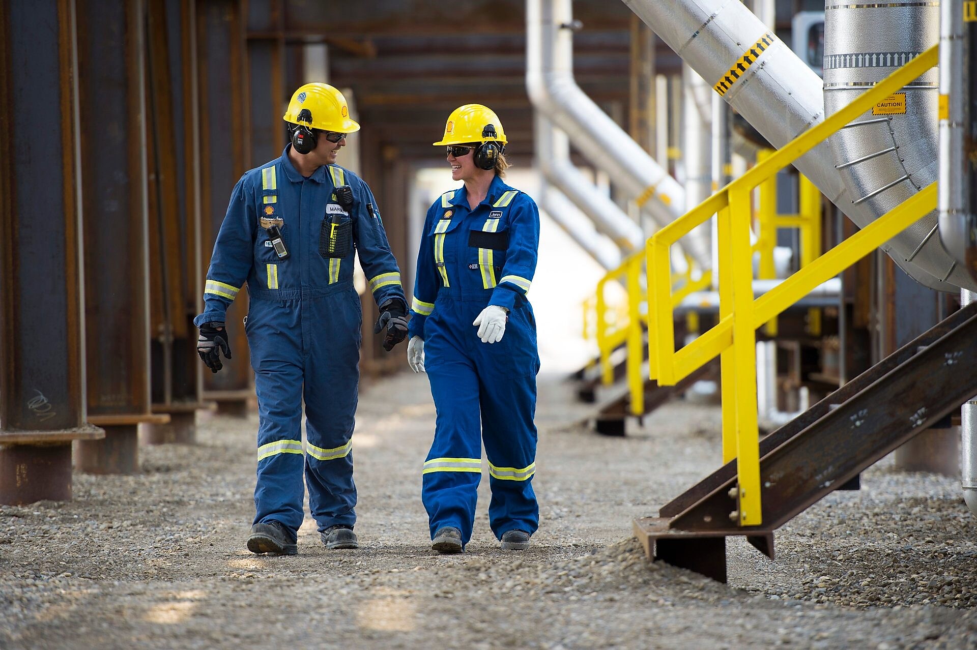 Two employees discuss a recently install distributor tray.